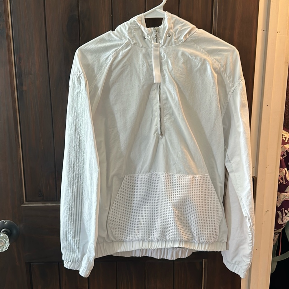white zip up windbreaker